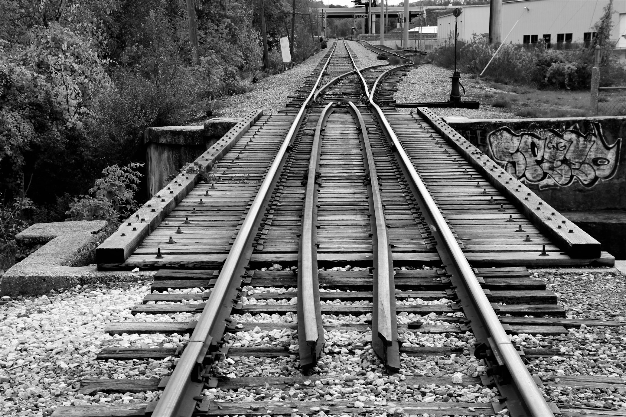 A grayscale photo of a railroad junction