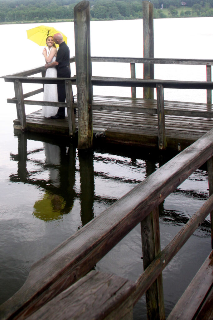 Wedding photo of Jac and Angela on a pier at Peace Valley Park